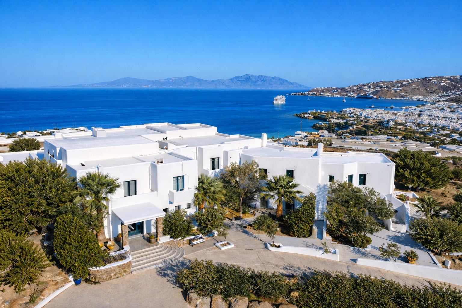 Hilltop view of Mykonos Town and the Aegean